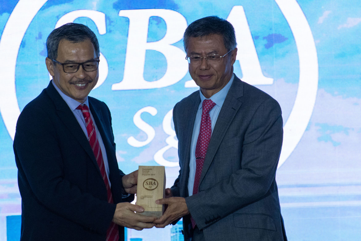 Mr. Bey Soo Khiang, Chairman, APRIL Group (right), receiving one of APRIL’s awards at the Sustainable Business Awards in Singapore.